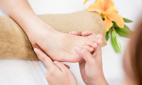 Woman receiving alternative therapy massage