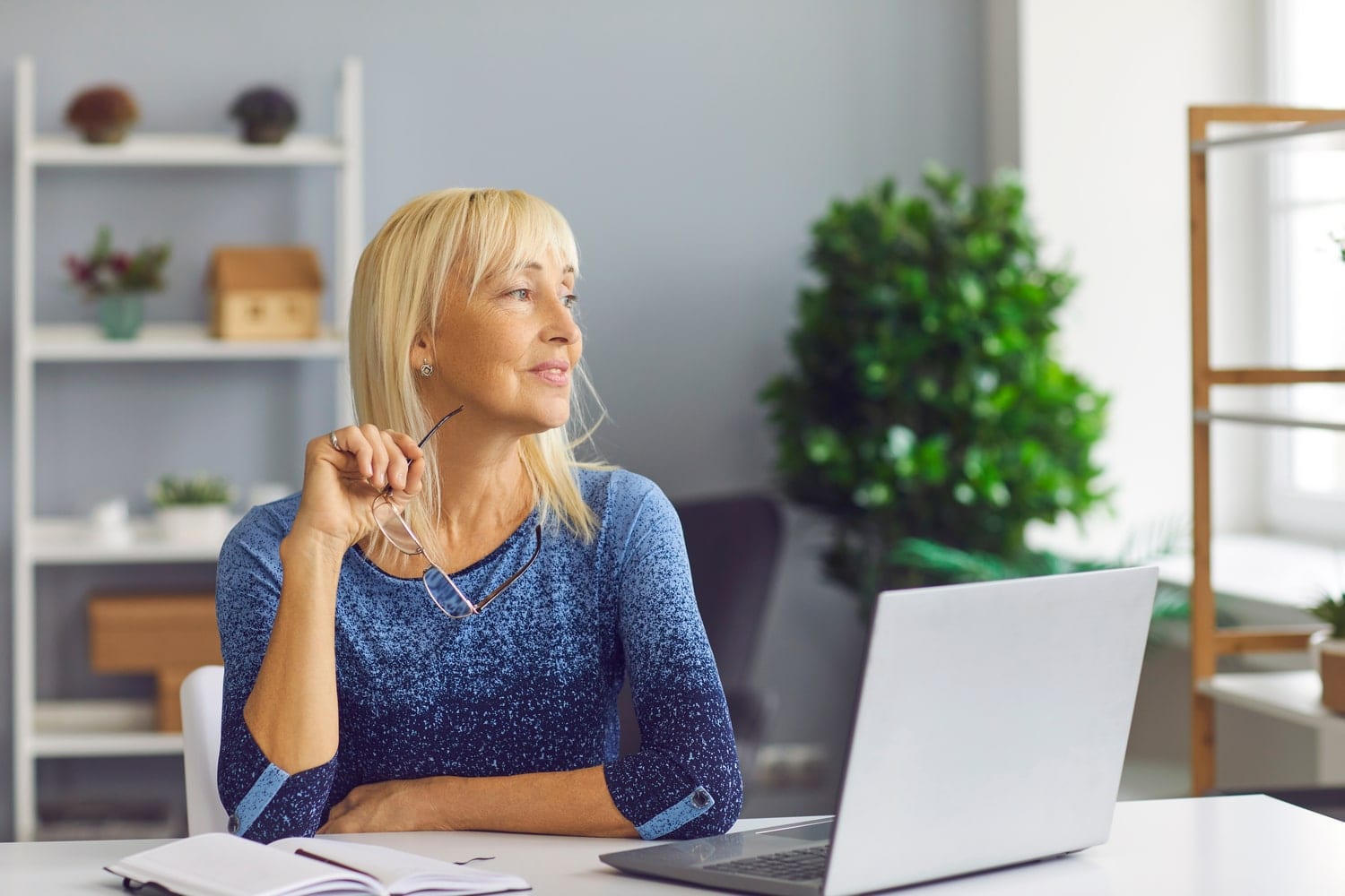 Blonde middle age Australian woman thinks about life insurance